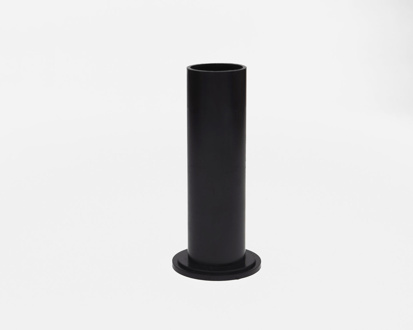 Black cylindrical object on a white background
