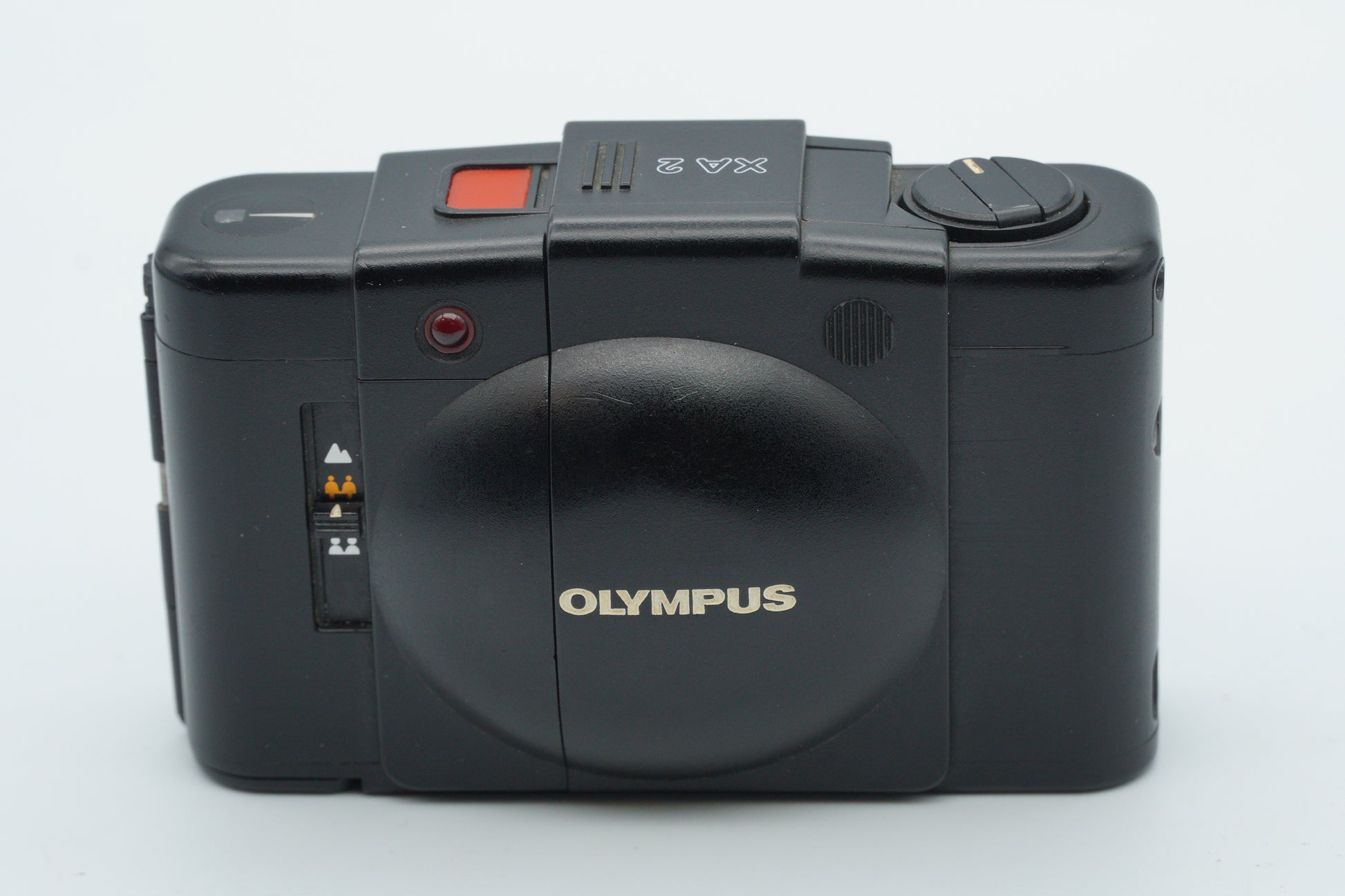 Black Olympus camera on a white background